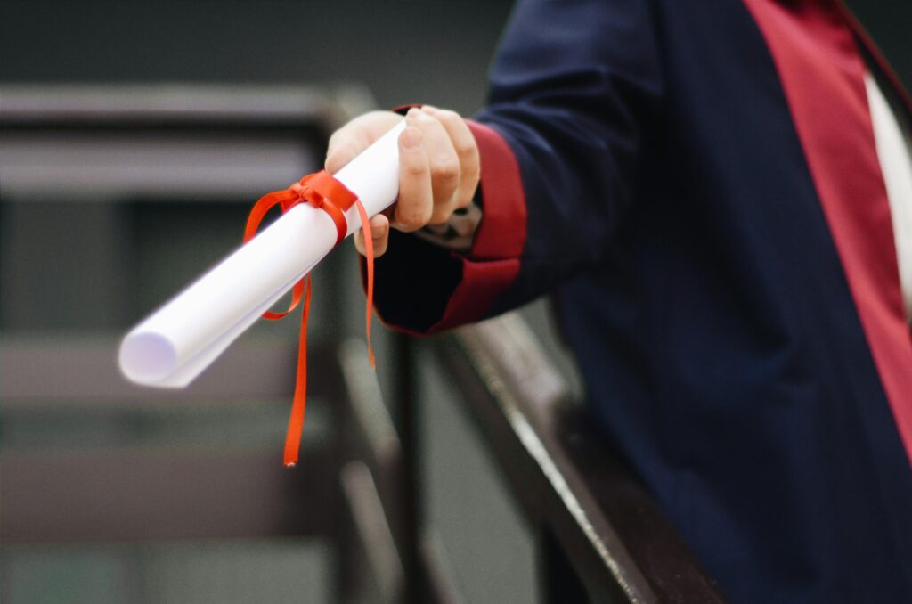 Person handing over a degree